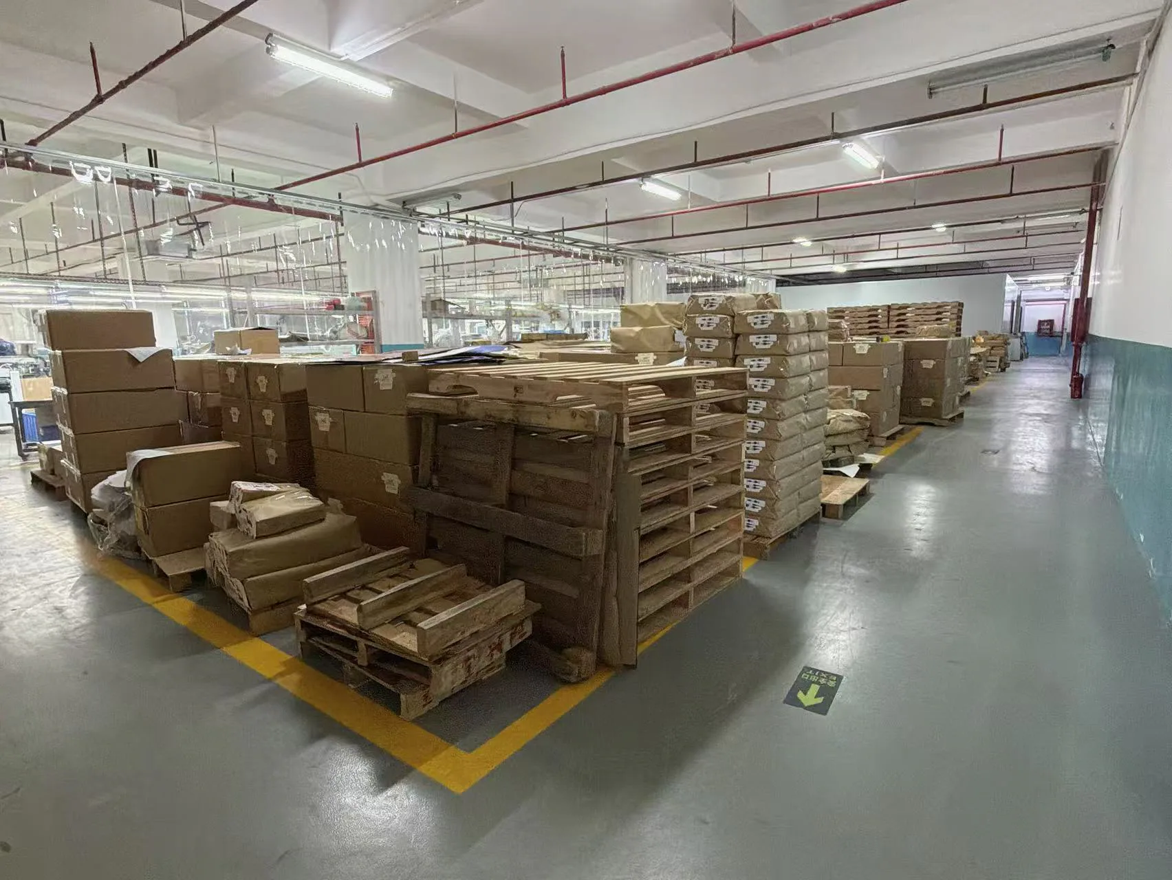 Packed materials and pallets in the factory staging area